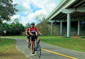 Bike riders enjoy one of the bike trails near Titusville, Florida.