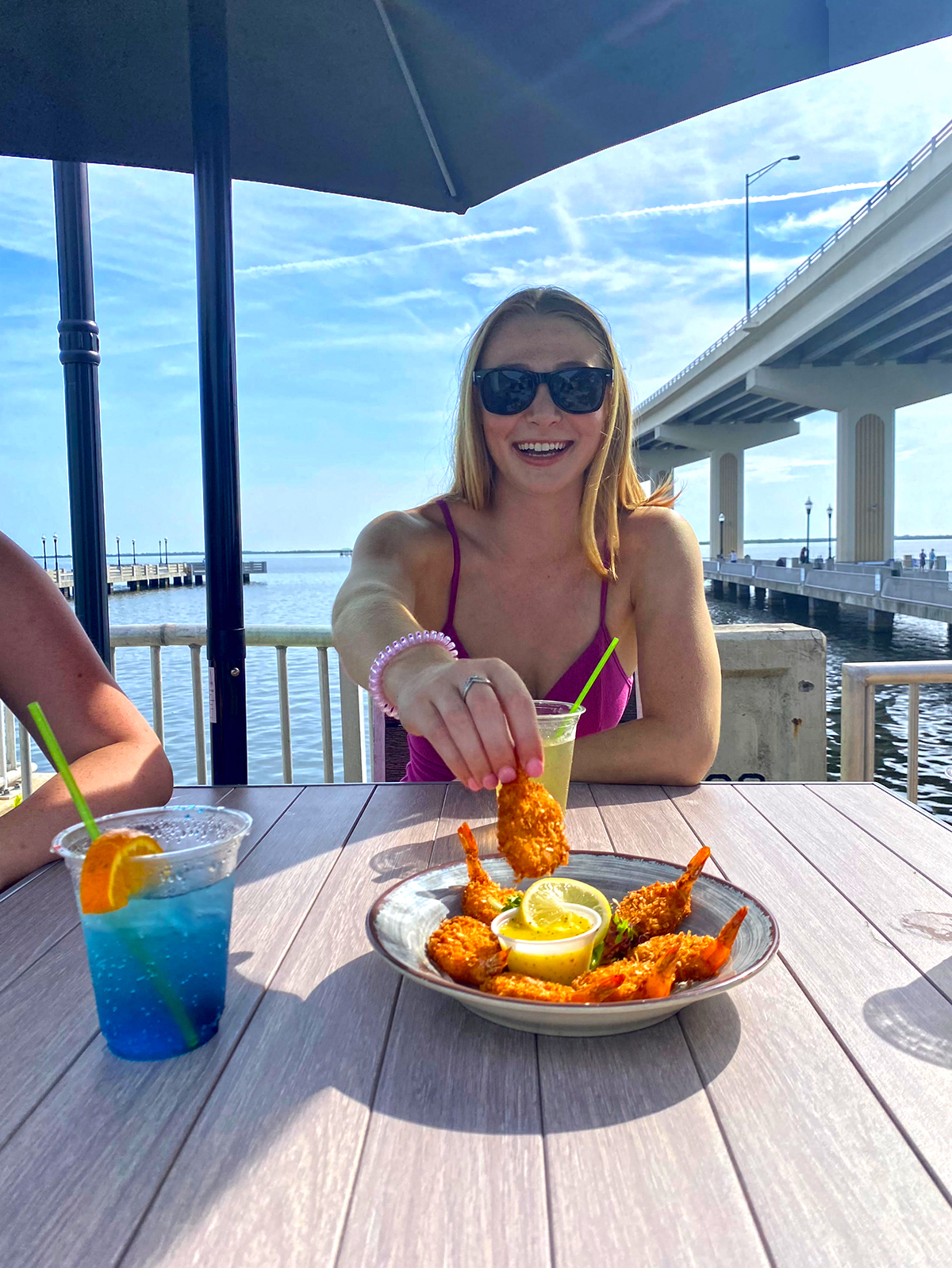 WaterfrontDining_Titusville_MaxBrewerBridge Girl eating